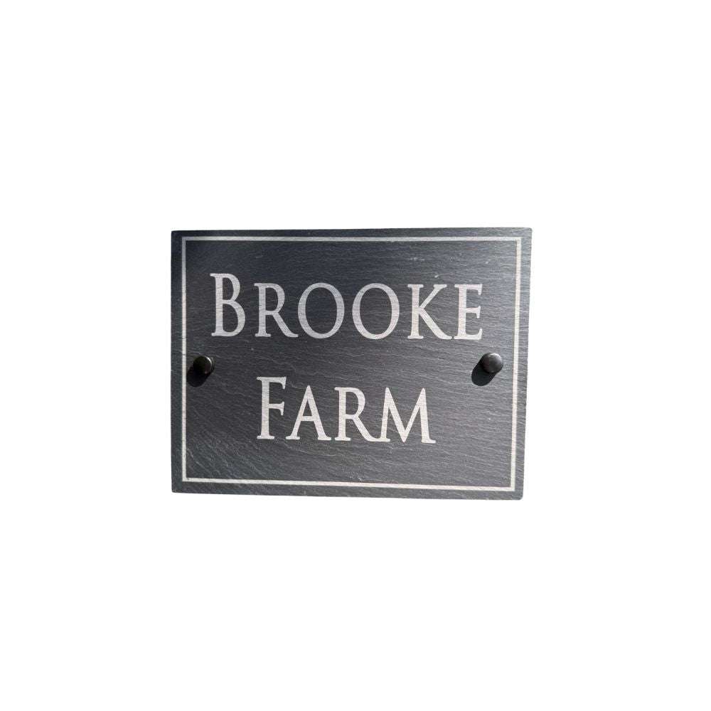 Slate house sign with 'Brooke Farm' text on a white background