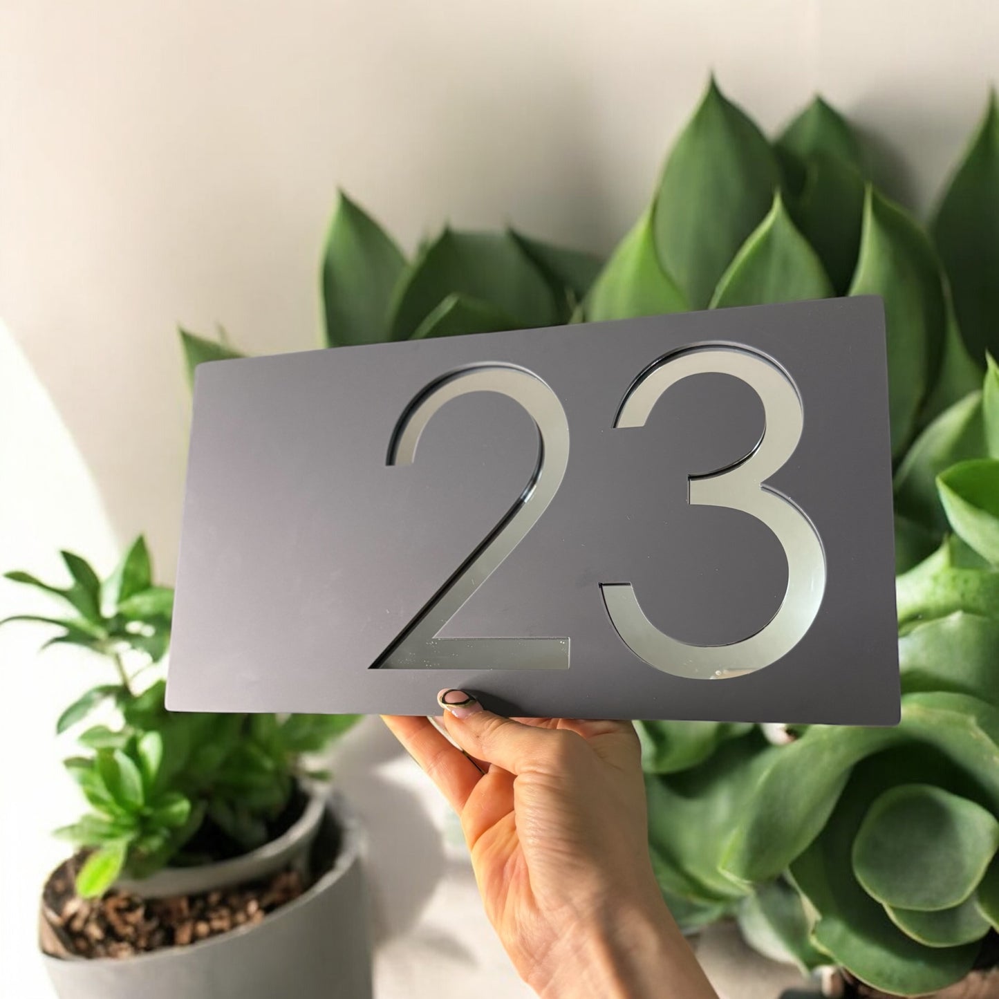 Elegant grey and silver acrylic house sign with bold number