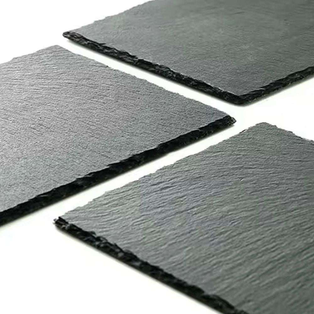 Three square slate tiles on a white background