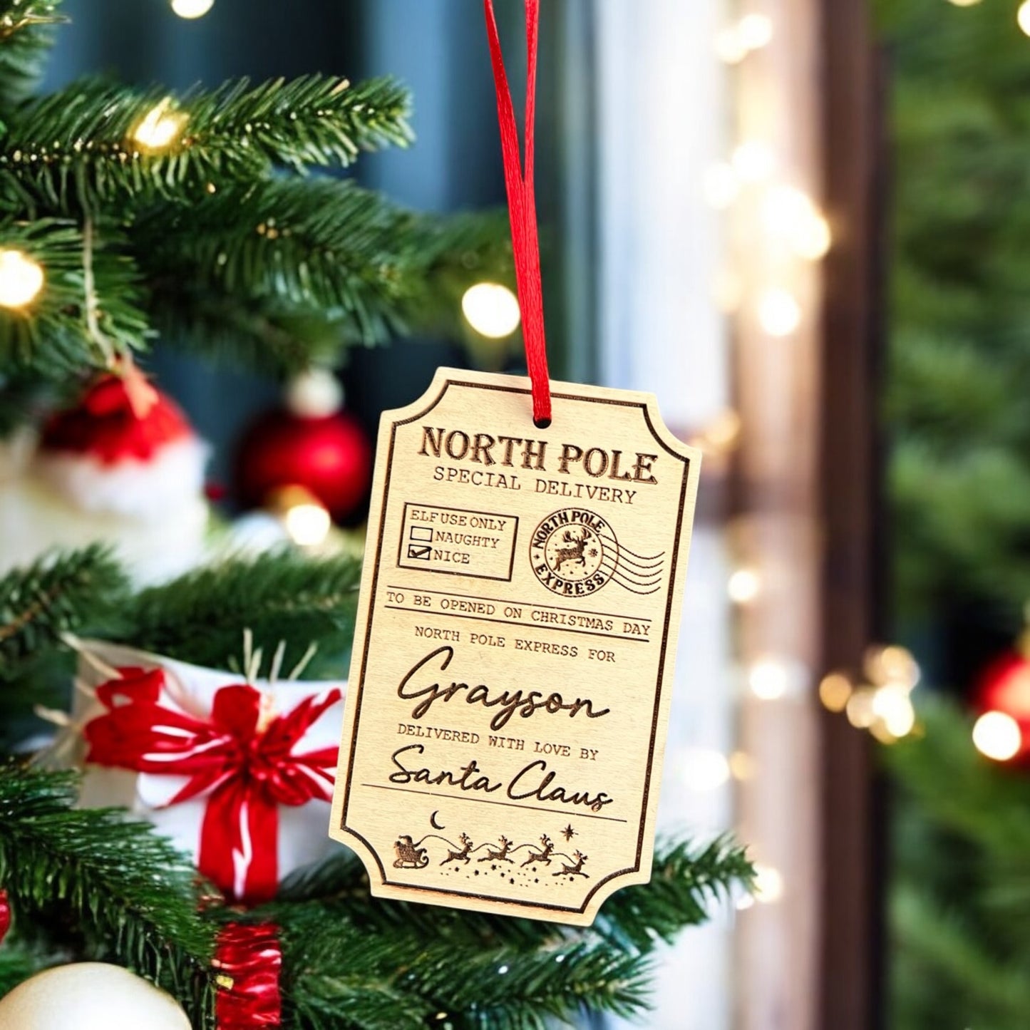 Custom name Santa delivery tag in festive engraved maple wood