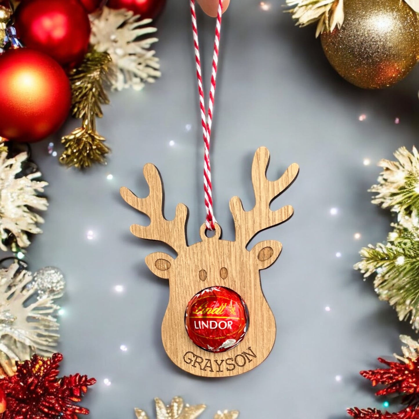 Oak Christmas reindeer decoration with red and white twine