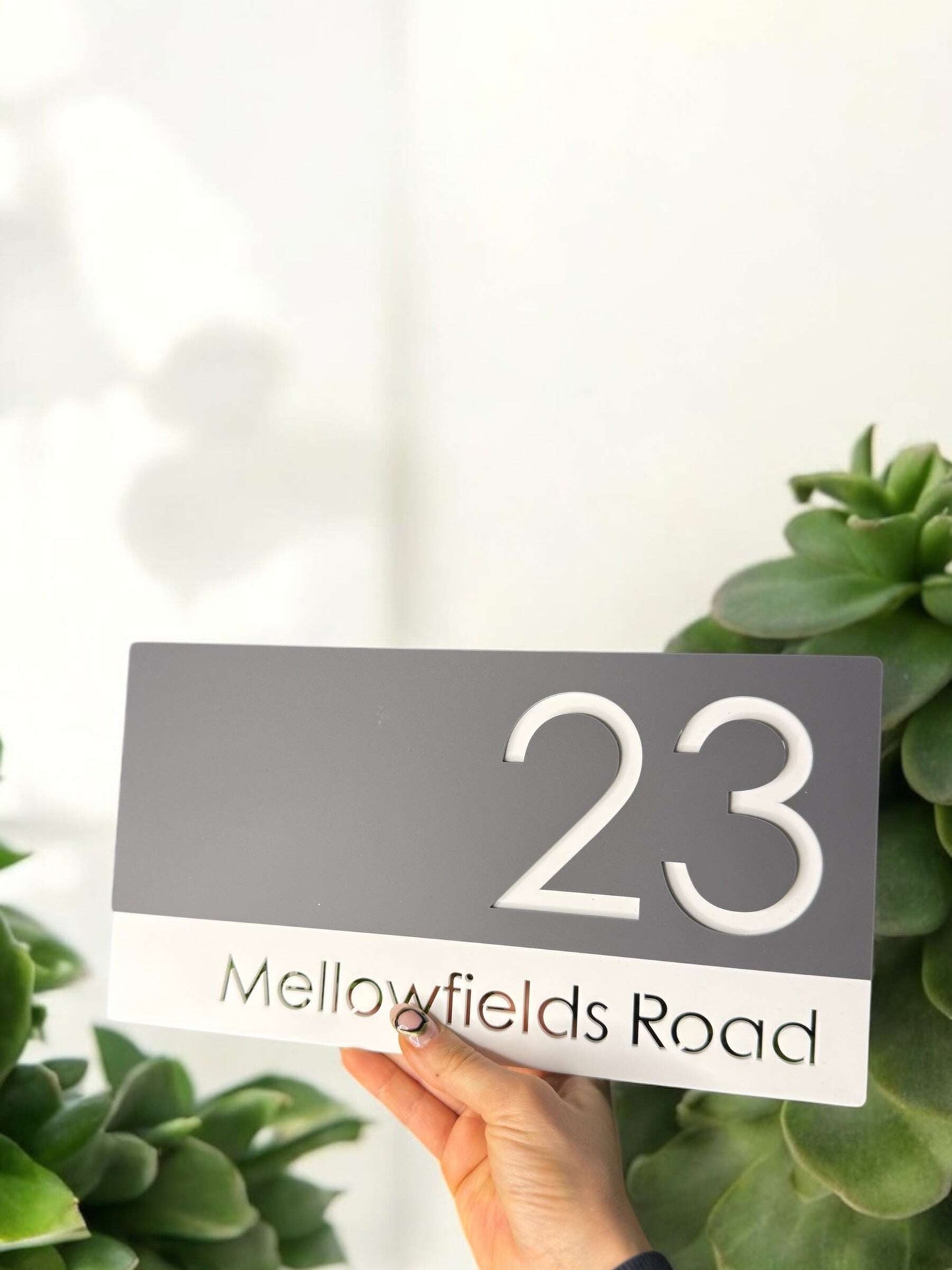 Stylish, high-quality acrylic house sign for a sleek home entrance