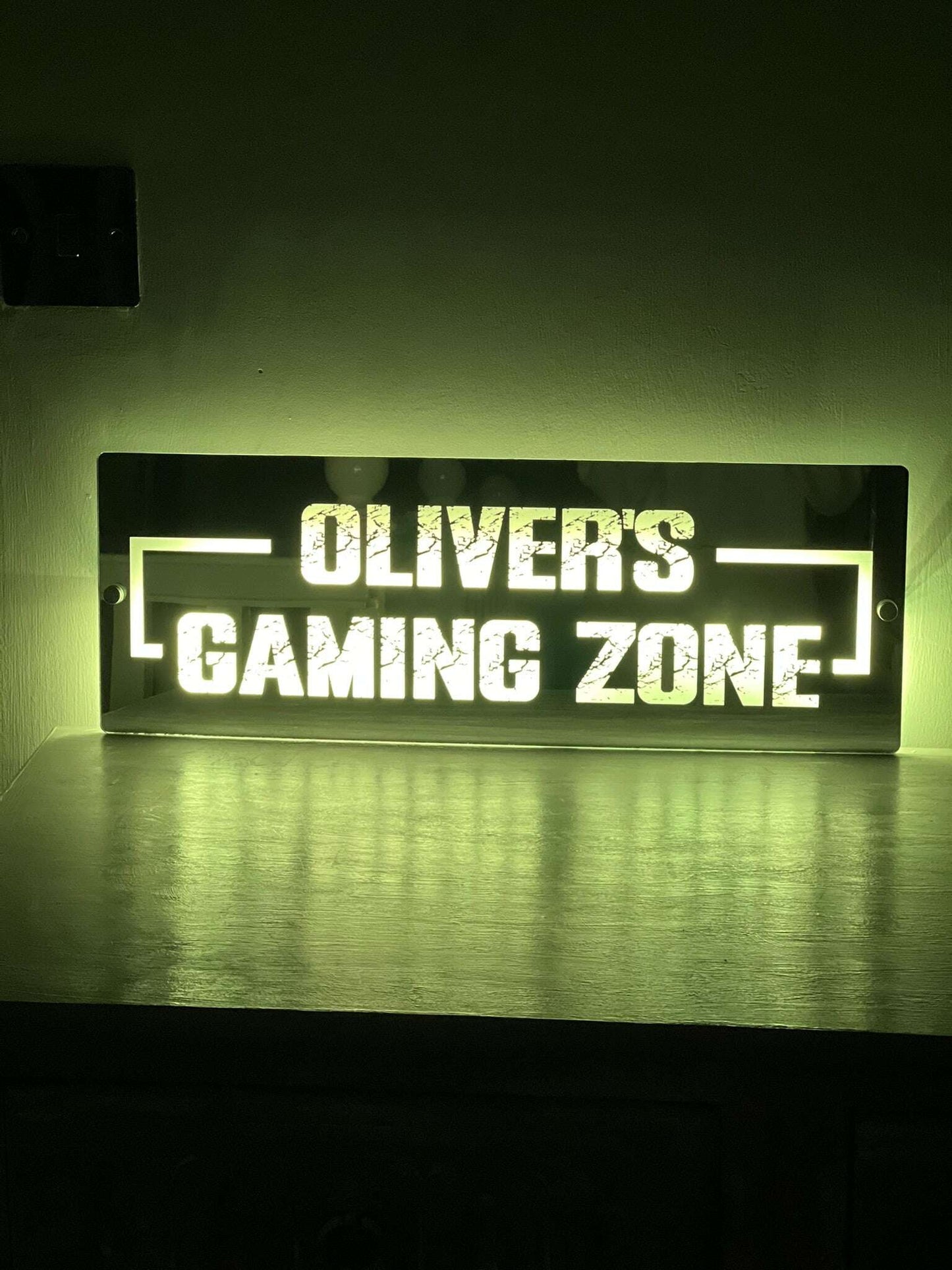 Stylish illuminated mirror sign for gaming enthusiasts