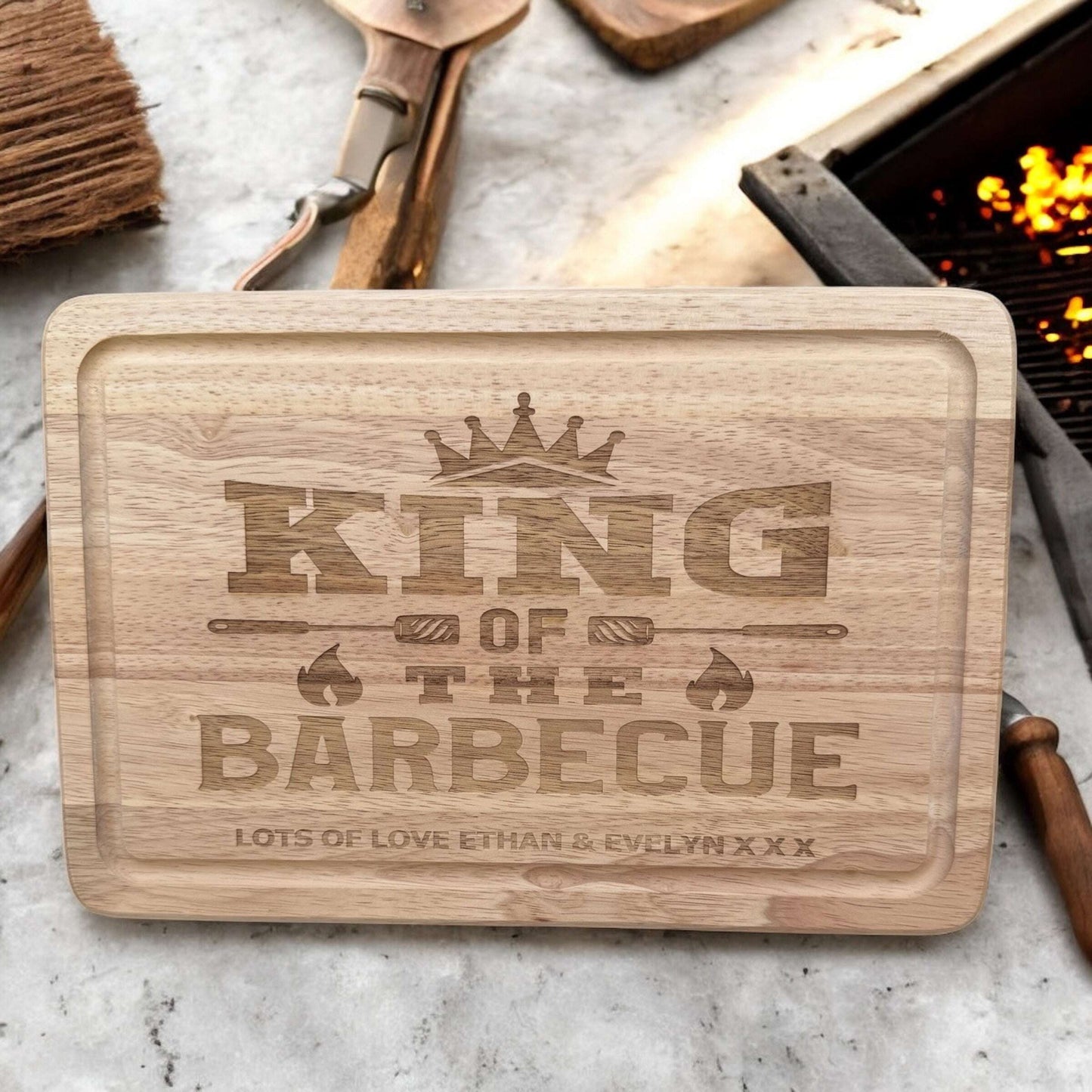 Wooden BBQ tray engraved with “King Of The Barbeque” and kids’ names