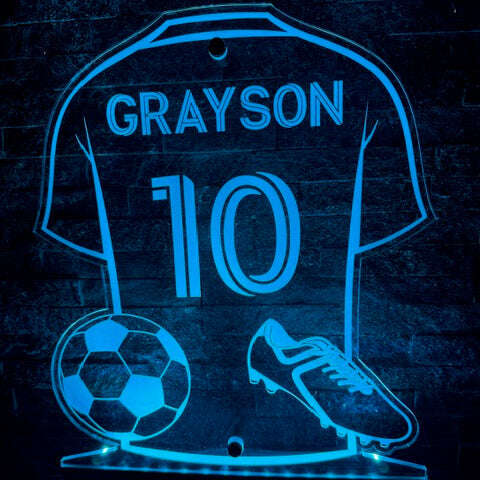 Wall-mounted personalised LED football shirt sign glowing in multiple colours