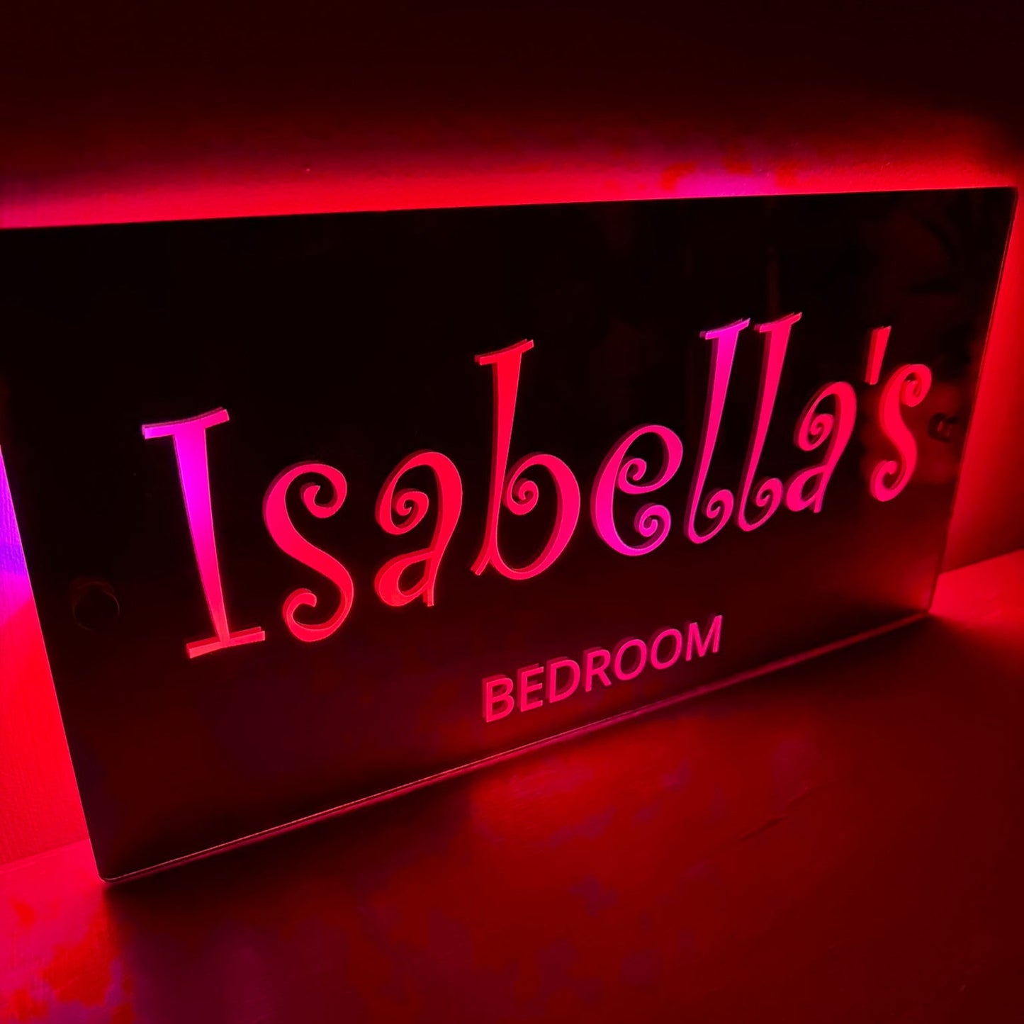 Close-up view of swirly font on the personalised LED mirror sign showing elegant and magical text design.
