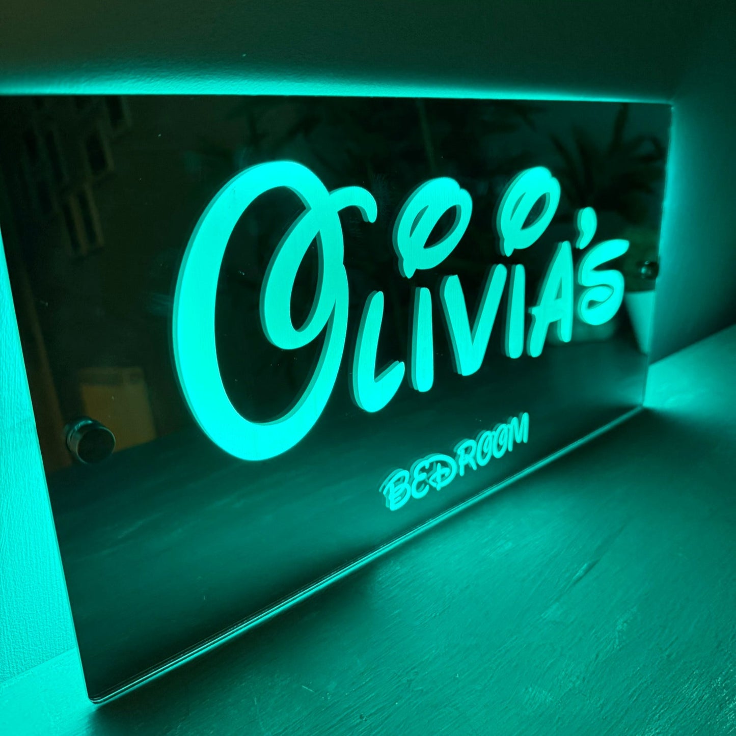 Close-up of the Disney-inspired font used on the personalised LED mirror sign, showing custom name detail.
