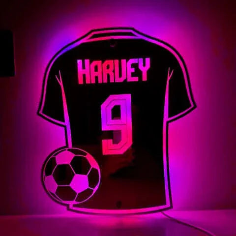 Football shirt sign with colour-changing lights and remote.