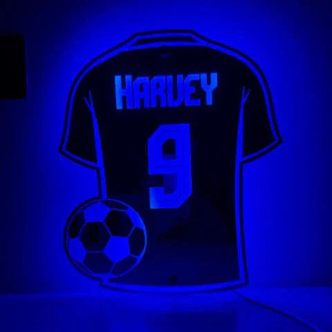 Football-themed LED sign with vibrant illumination.
