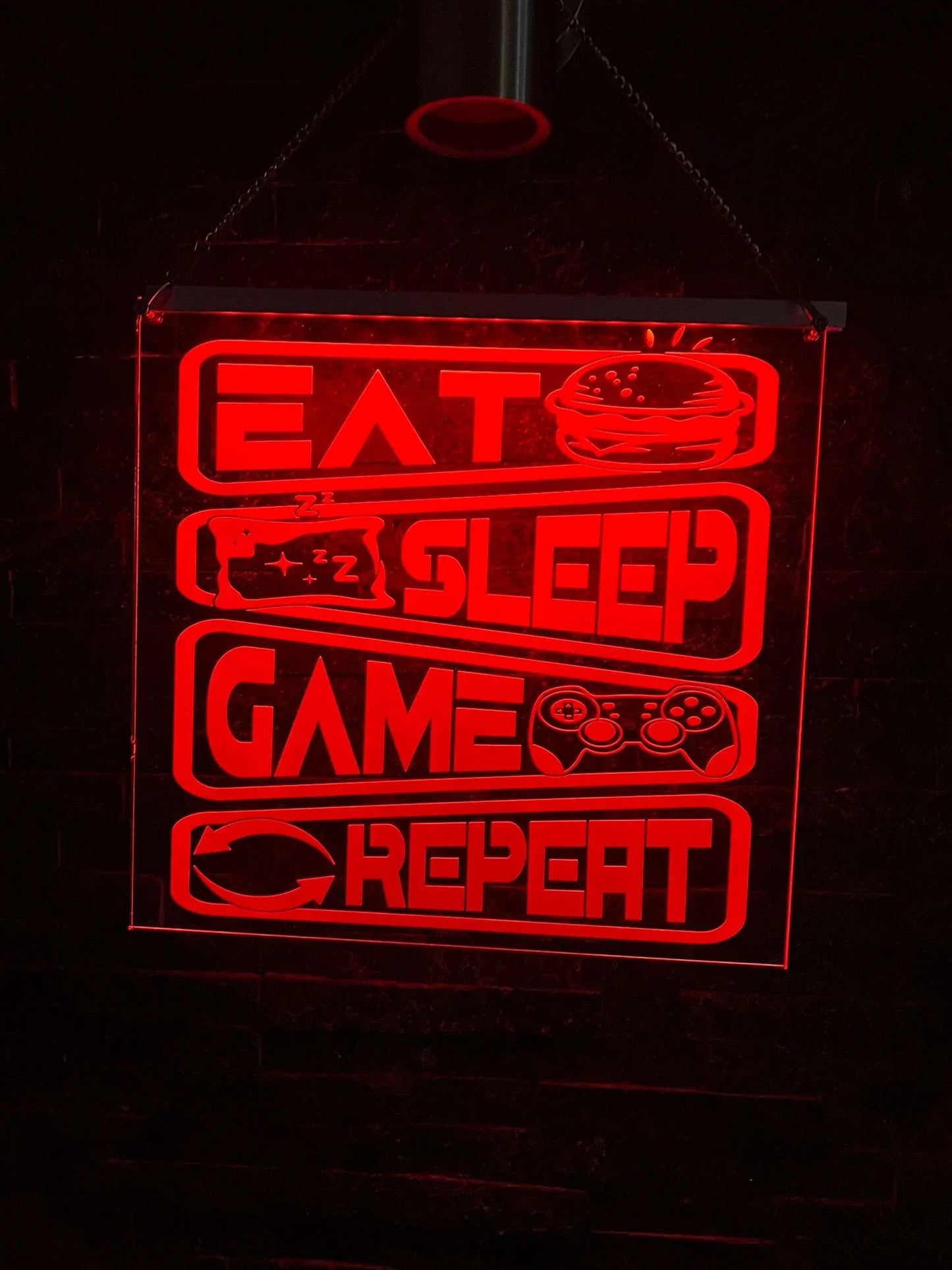 Illuminated “Eat Sleep Game Repeat” LED sign for gamers