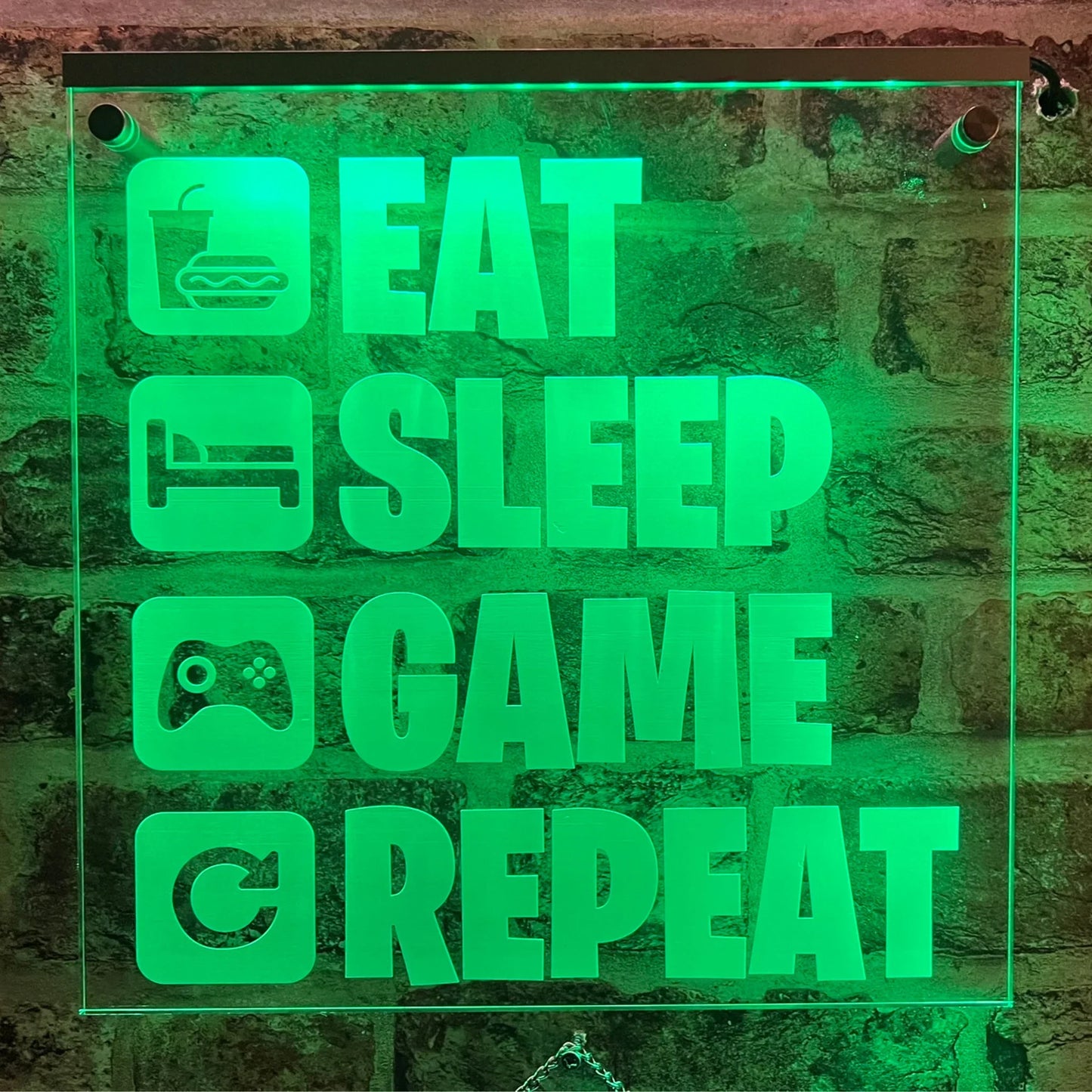 LED sign with "Eat Sleep Game Repeat" perfect for gamers