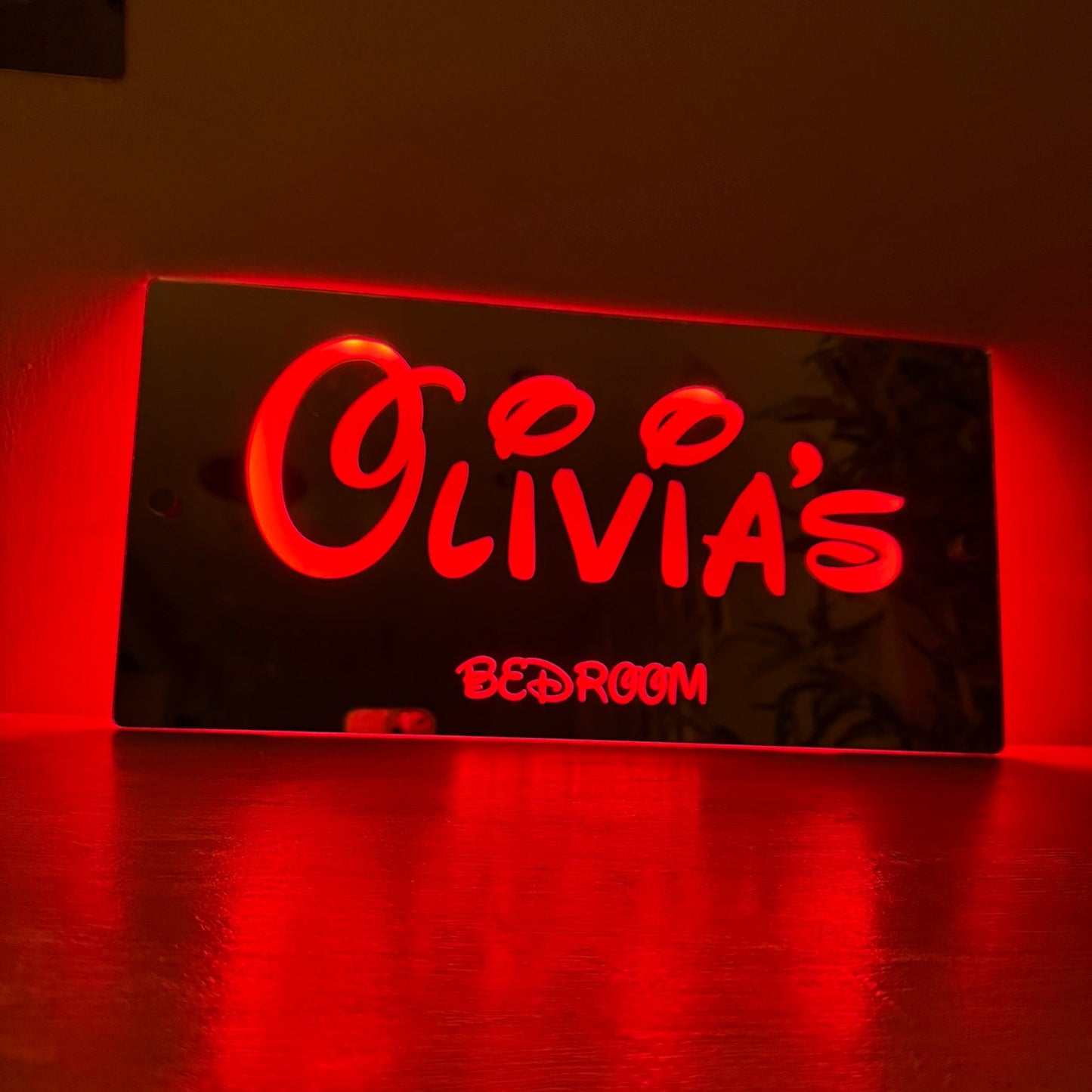 LED name sign with included remote control and USB cable for easy power and light control.