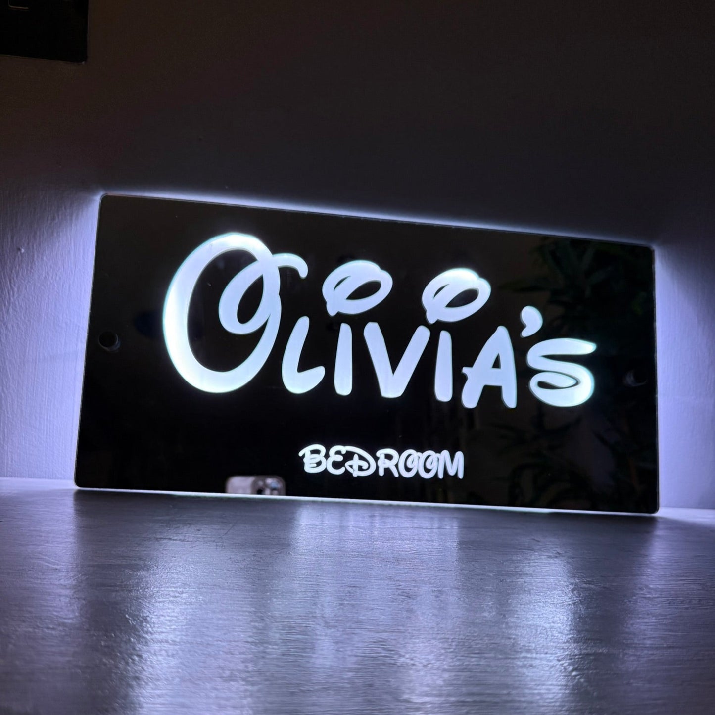 Showcasing the 366 different light effects and colour options of the personalised LED sign.