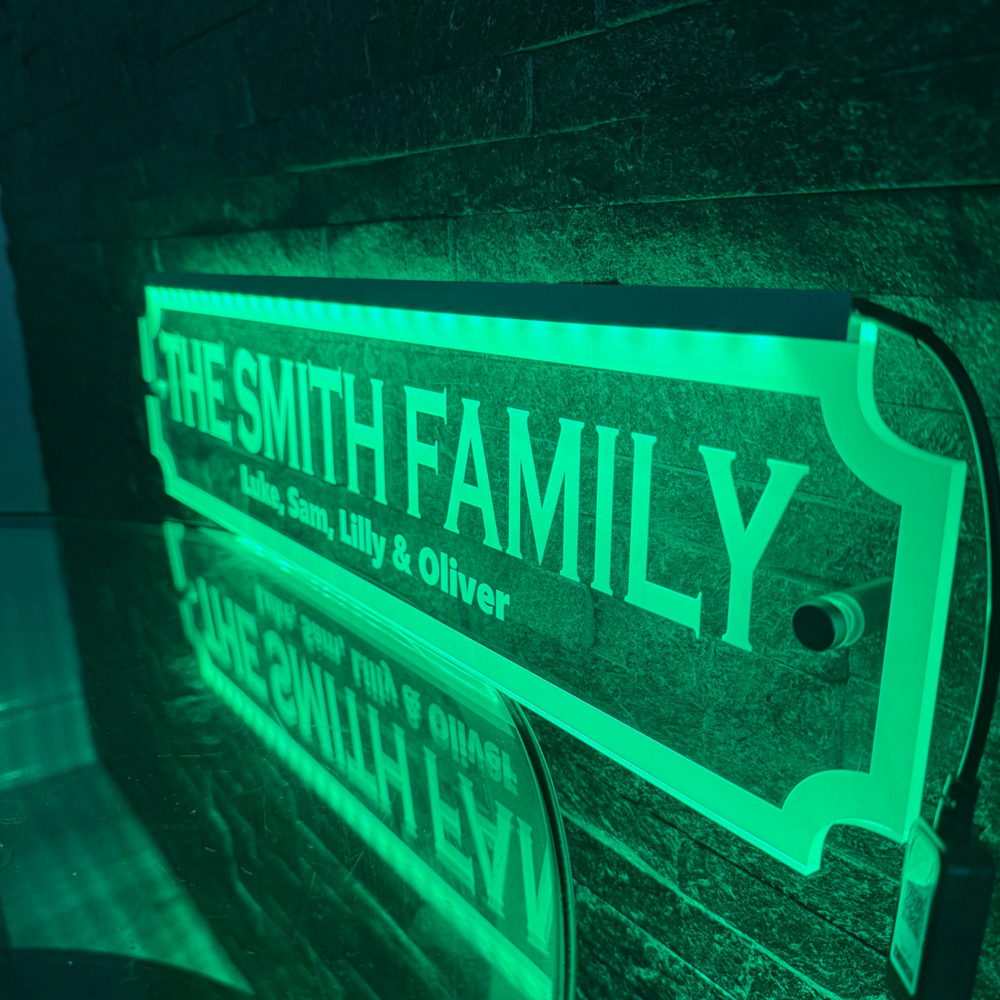 LED family sign showing remote and app control options