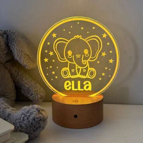Personalised cute night light with custom name glowing on wooden base
