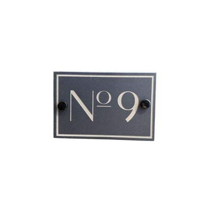 Navy blue rectangular sign with white text 'No 9' on a white background