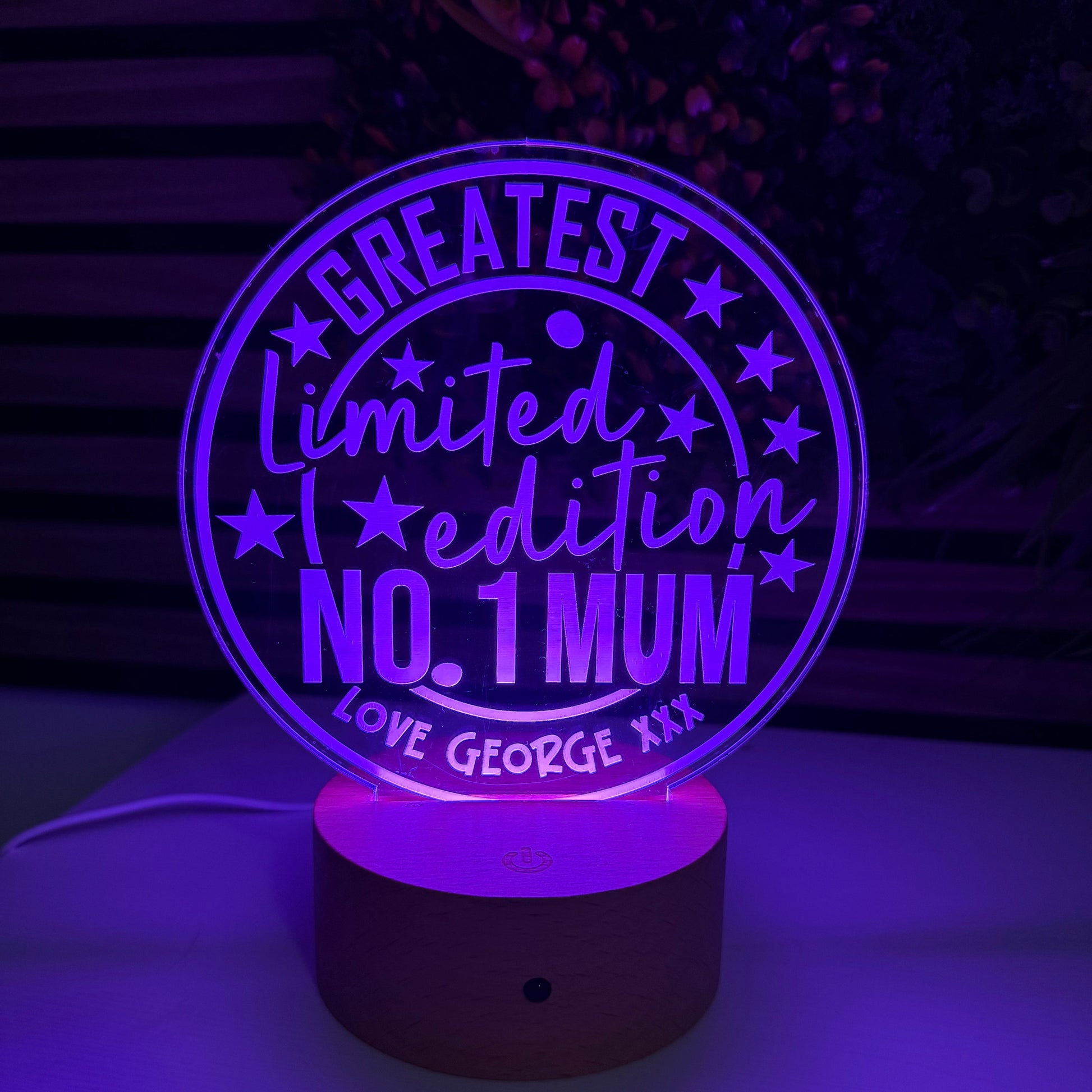 Decorative light with 'No. 1 Mum' text on a dark background