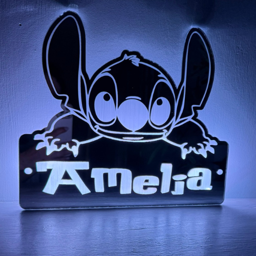 Close-up of Stitch LED personalised name mirror glowing in blue
