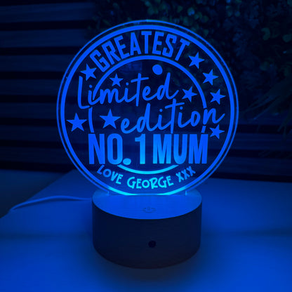 Glowing blue light bulb with 'No. 1 Mum' text on a dark background