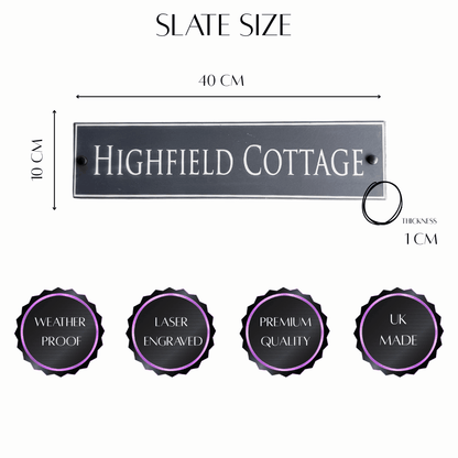 Outdoor engraved slate sign mounted on wooden gate