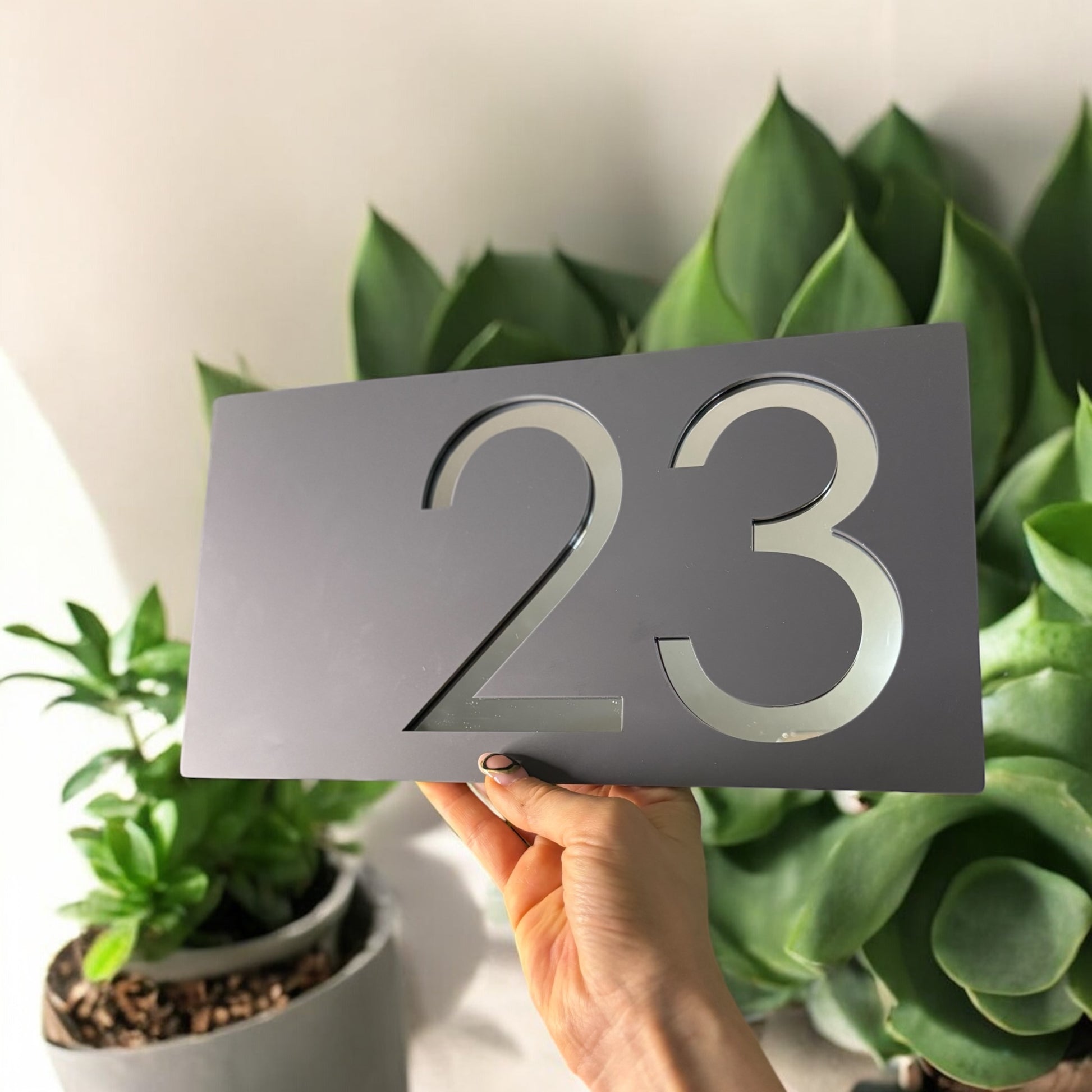 Elegant grey and silver acrylic house sign with bold number