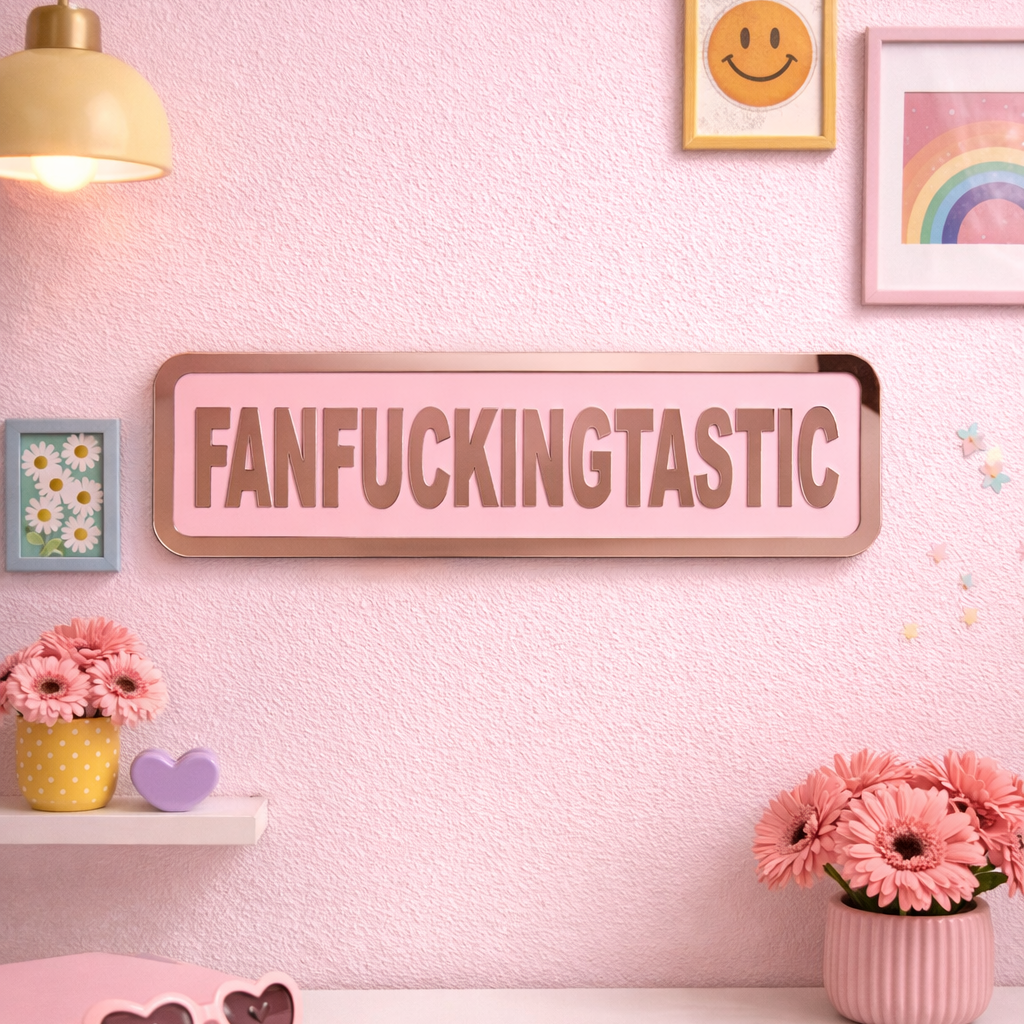 Decorative wall sign with 'FANFUCKINGTASTIC' on a pink wall with flowers and sunglasses.
