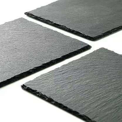 Three square slate tiles on a white background