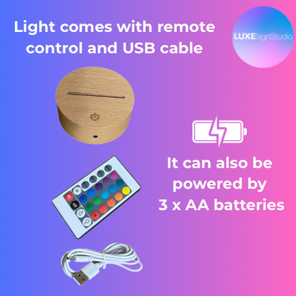Wooden light fixture with remote control and USB cable on a gradient background