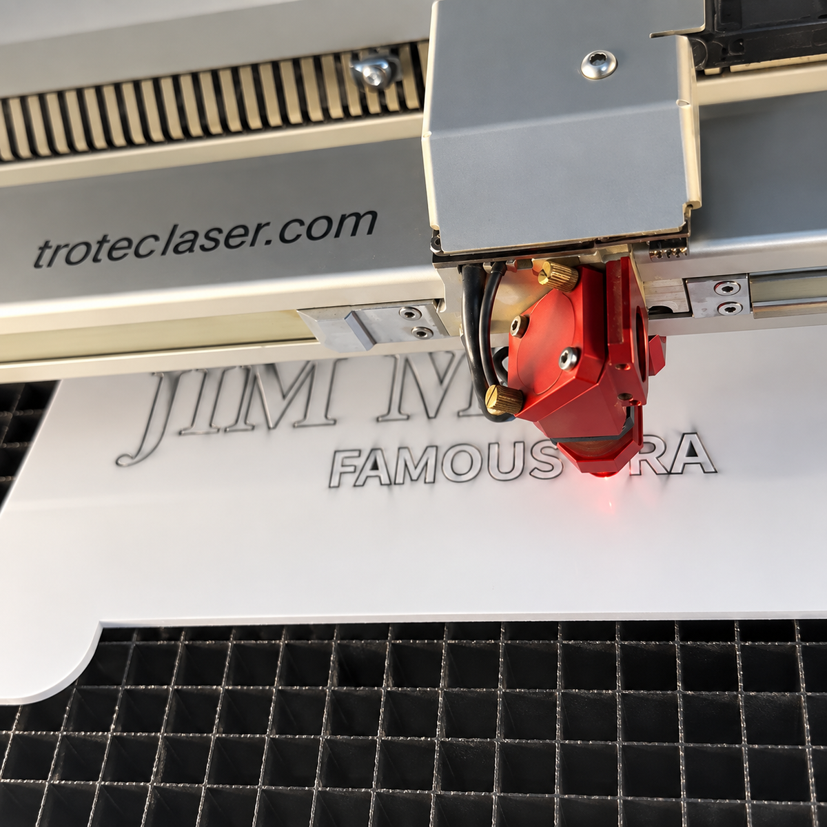 Trotec laser engraving white acrylic in the Luxe Sign Studio workshop