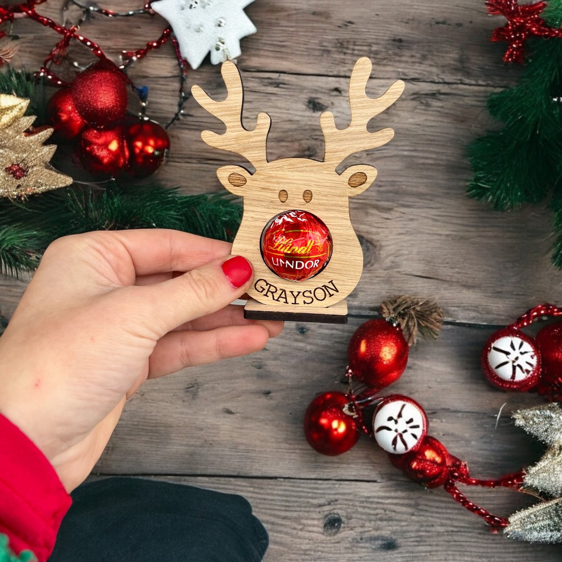 Festive reindeer name place decoration for holiday celebrations