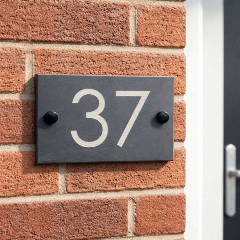 House number '37' on a brick wall