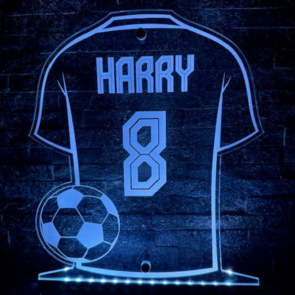 LED football shirt sign mounted on a bedroom wall as decor.