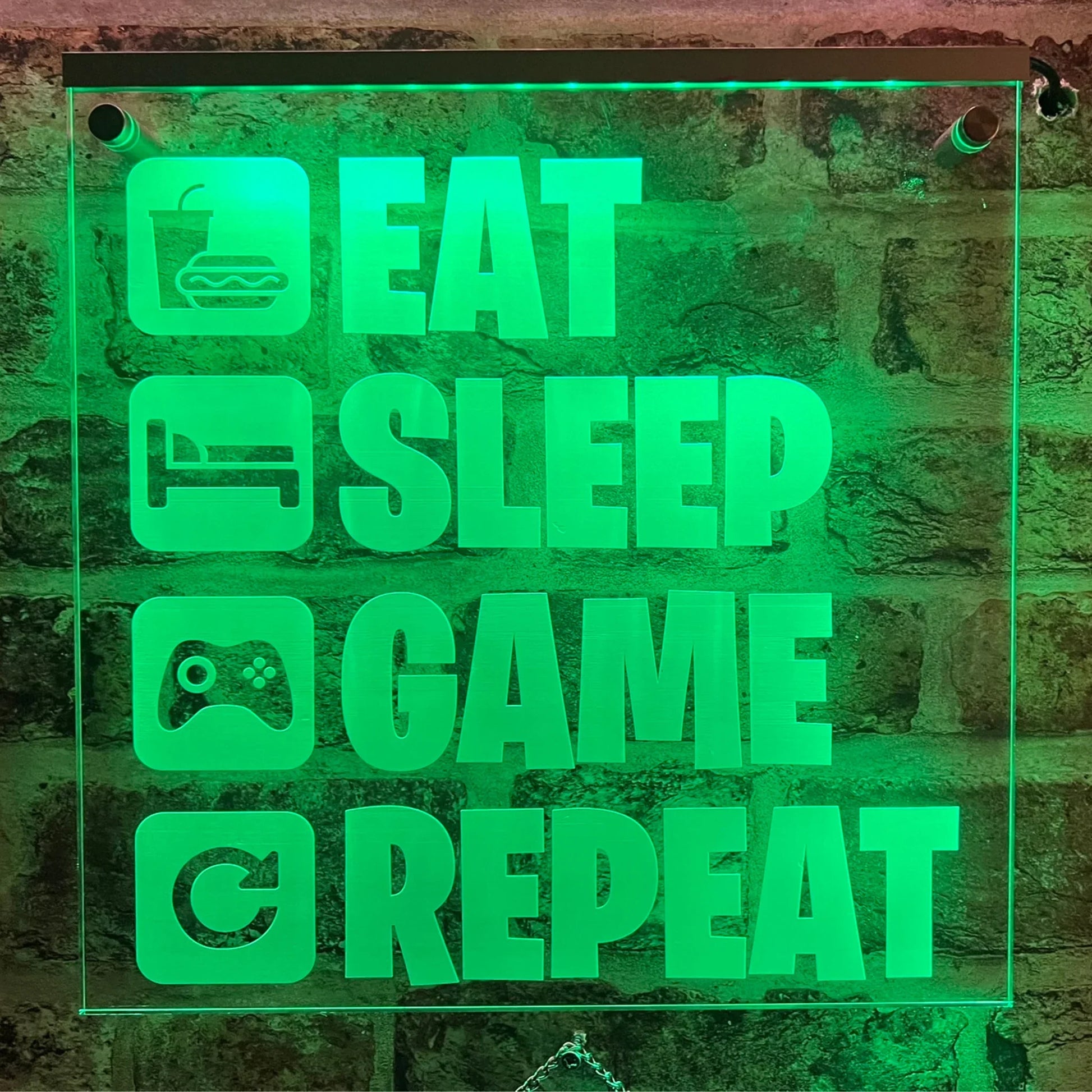 LED sign with "Eat Sleep Game Repeat" perfect for gamers