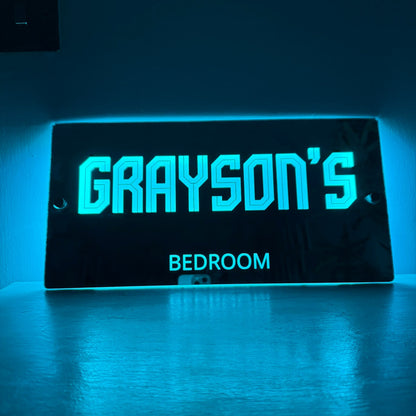 Personalised LED mirror sign wrapped as a gift, ideal for birthdays or Christmas presents