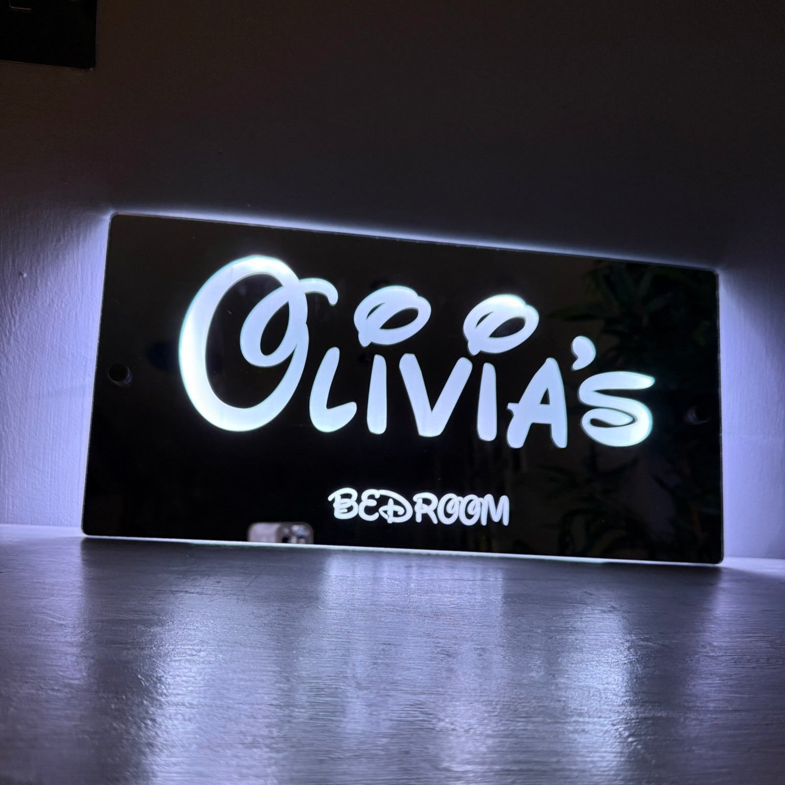 Showcasing the 366 different light effects and colour options of the personalised LED sign.