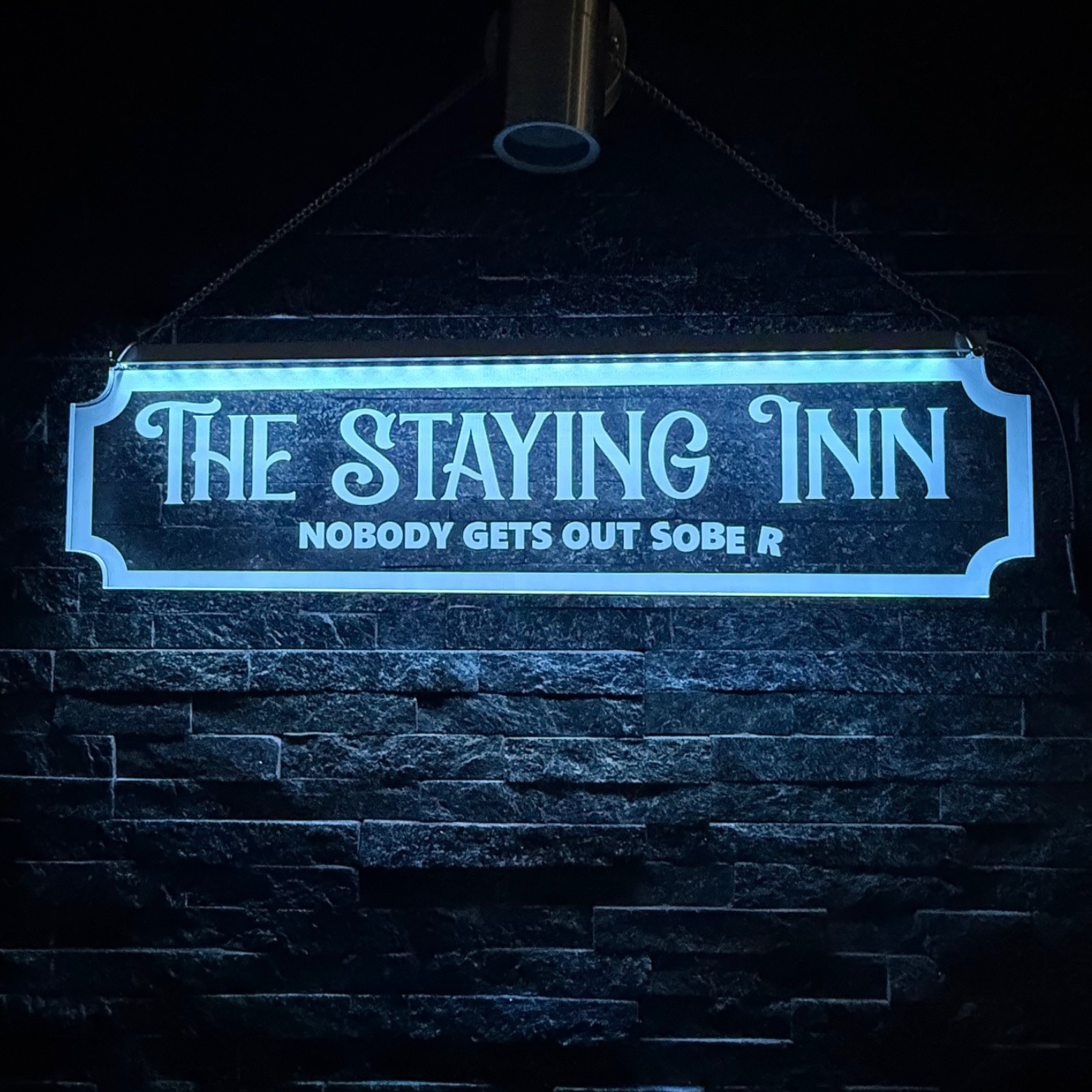 Custom LED sign mounted on wall using stand-offs