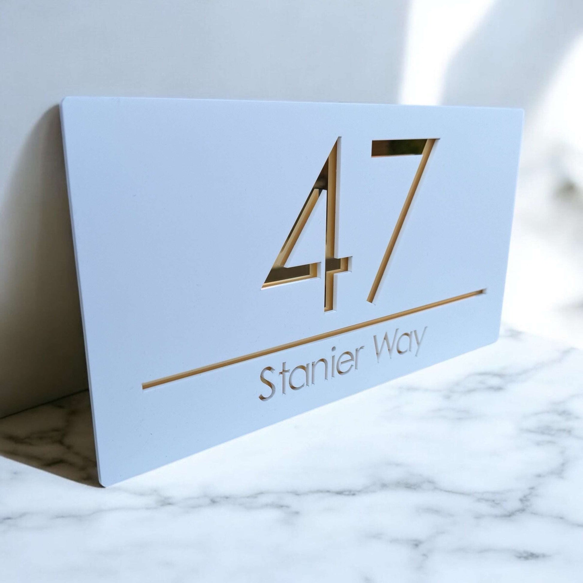 Durable floating sign in white matte with silver, copper, or gold mirror base